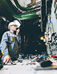 power plant worker at a control panel